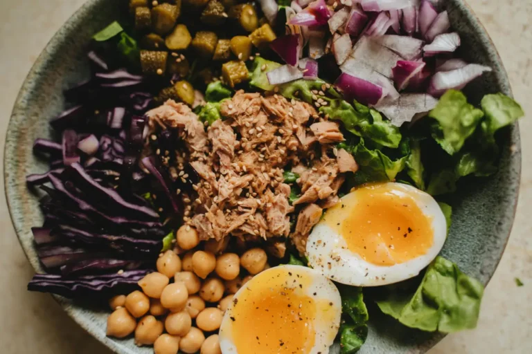 Nutritious grain bowl with tuna, soft-boiled eggs, and purple cabbage (1)