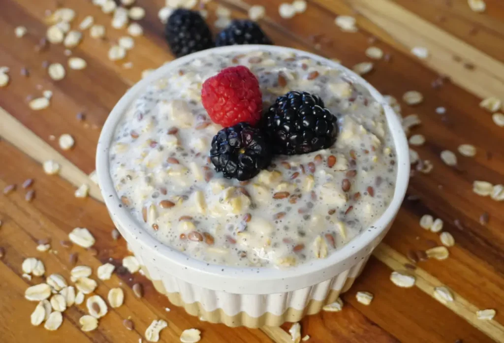 Overnight oats with chia seeds, topped with fresh raspberries and blackberries