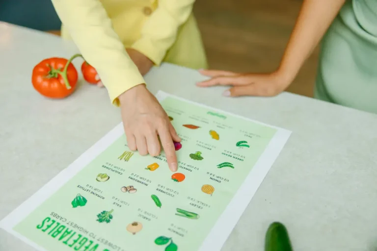 Reviewing a nutritional chart for low-carb vegetables.