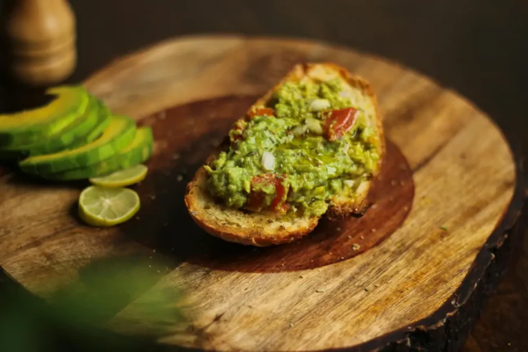 Toasted sourdough topped with smashed avocado and tomatoes.